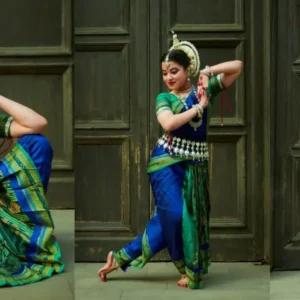 Odissi dancer performing a traditional pose with expressive hand gestures and intricate footwork in colorful attire.